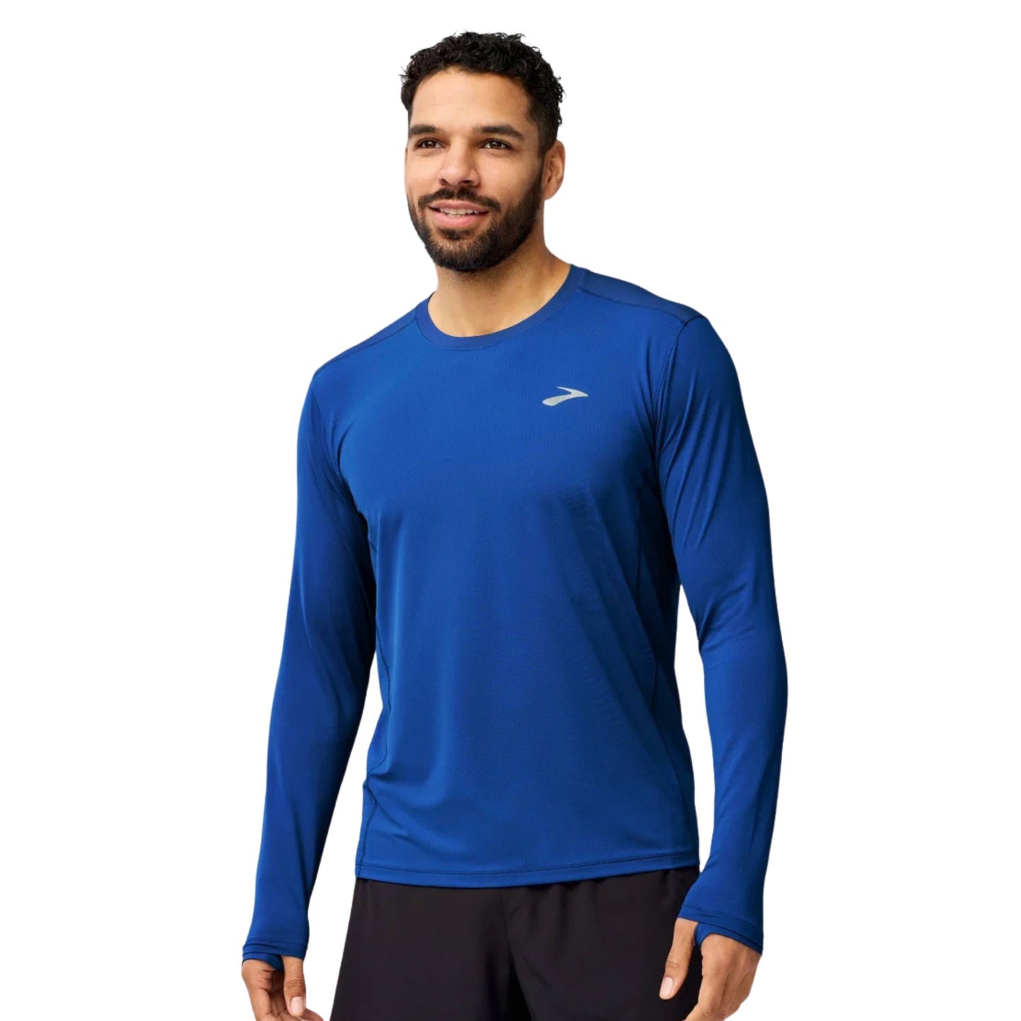 Man wearing a blue Brooks long sleeve shirt on a white background