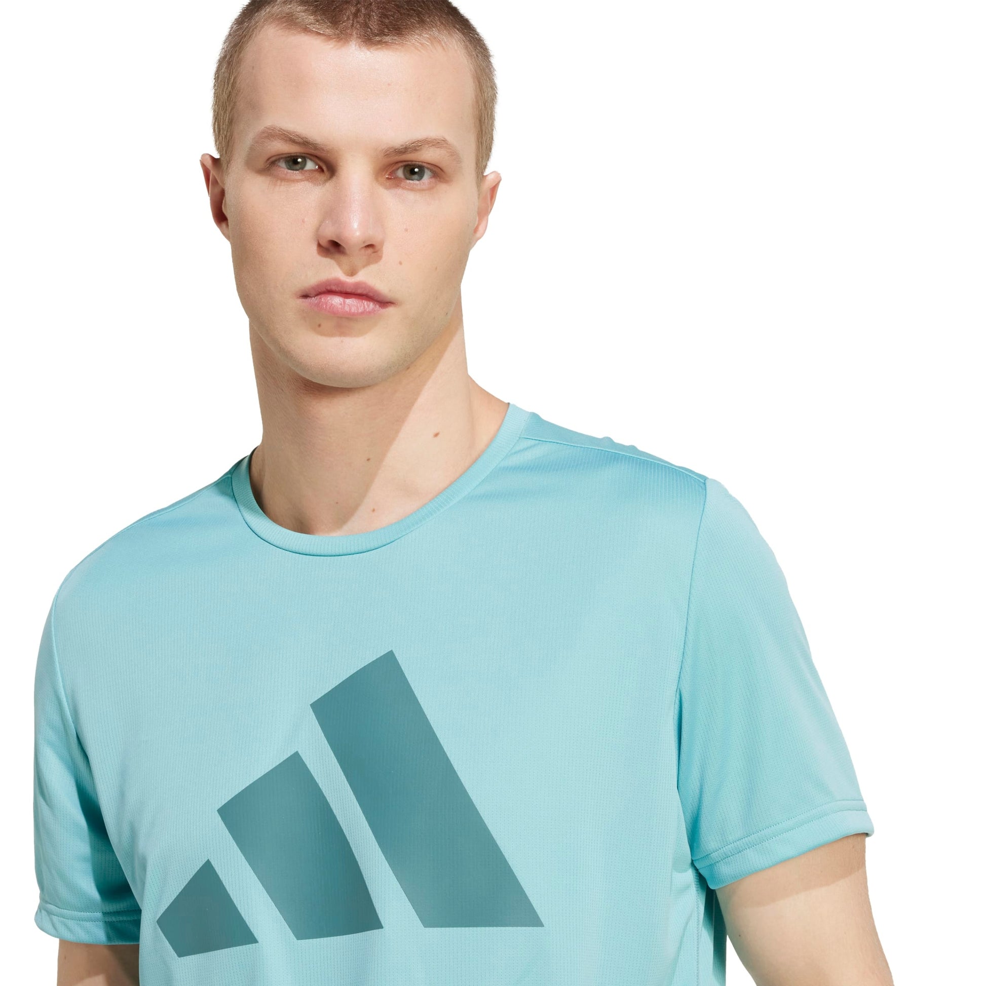A man wearing an Adidas mint shirt
