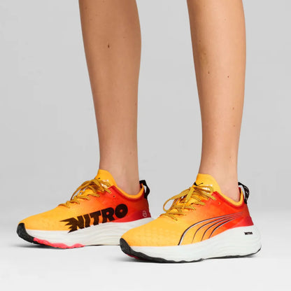 Orange and yellow running shoes with 'Nitro' and 'Puma' branding on a light gray background