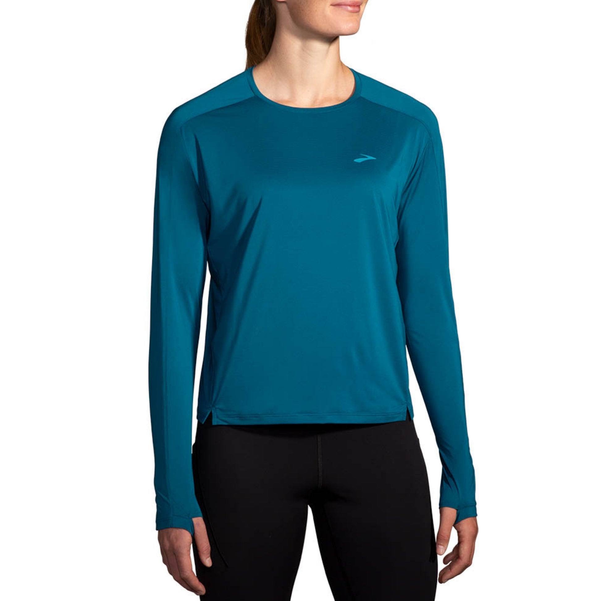 Woman wearing a blue Brooks shirt on a white background