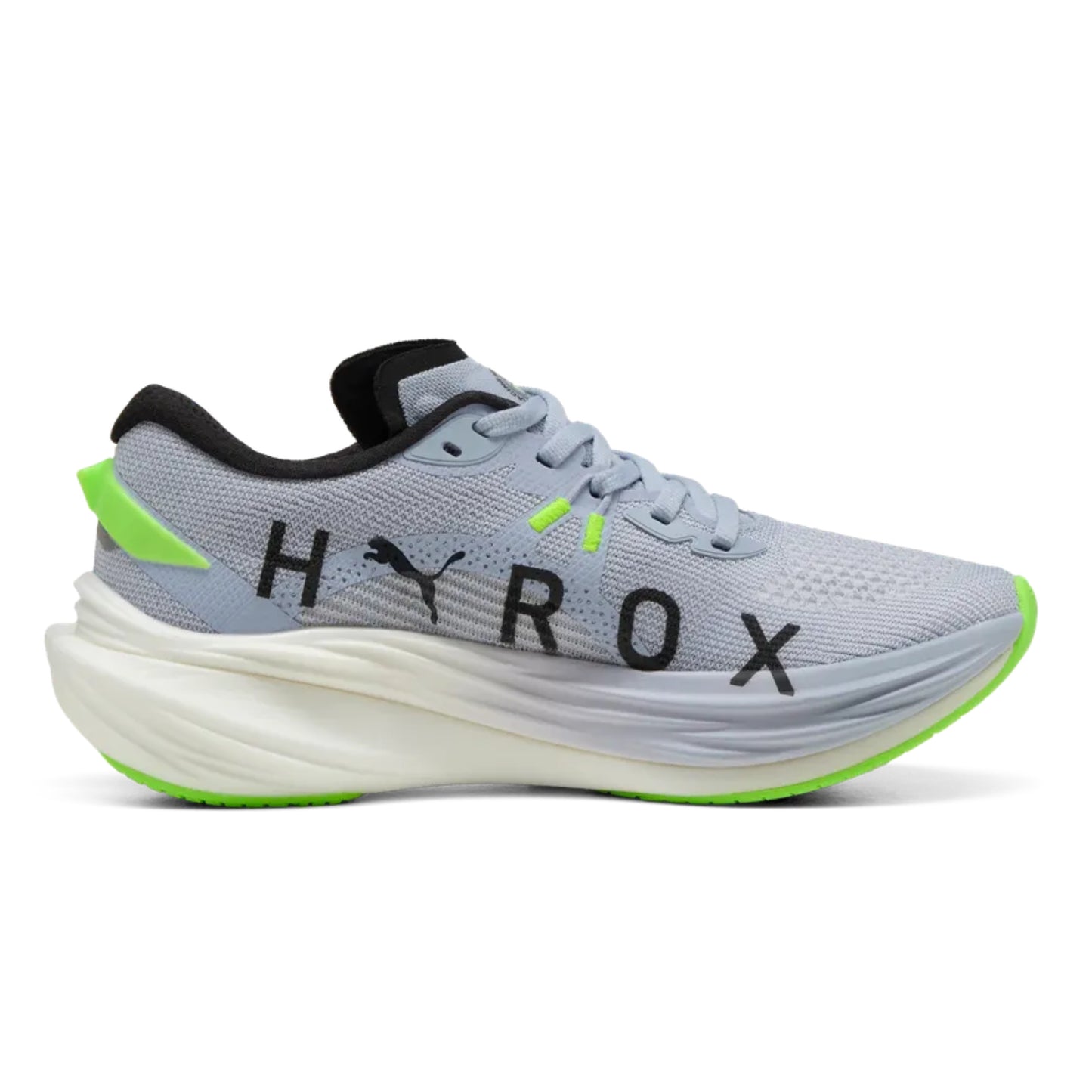 Gray Puma running shoe with green accents and 'Hyrox' branding on a white background