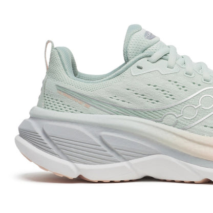 Light blue Saucony running shoe with white sole on a white background