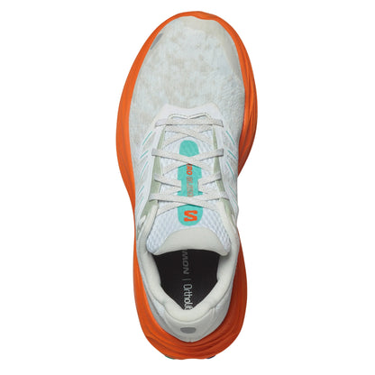 White and orange running shoe with a visible brand logo on a white background