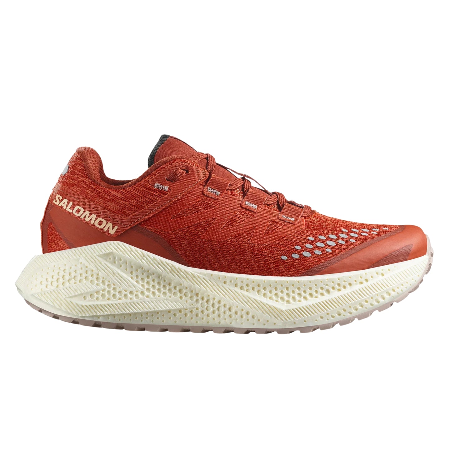 Red Salomon running shoe with white sole on a white background
