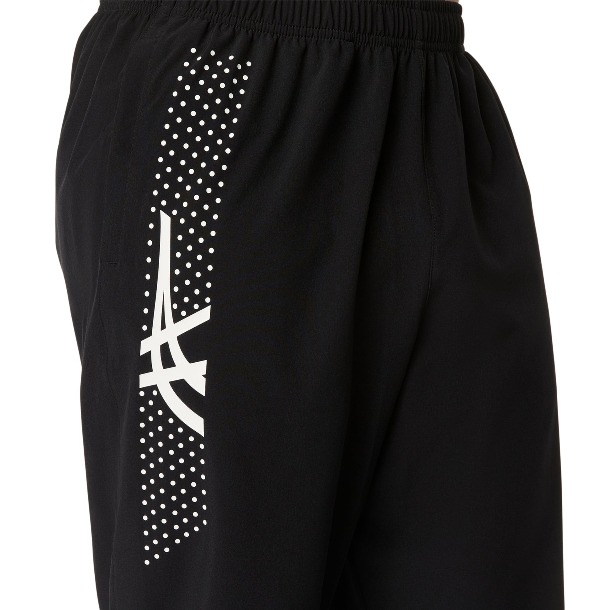 Black shorts with a white logo and polka dot pattern on a white background