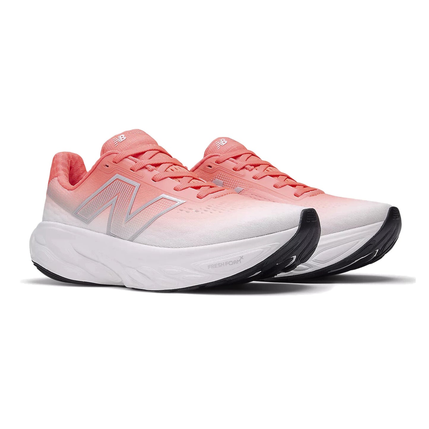 Pair of red and white running shoes with white soles on a white background