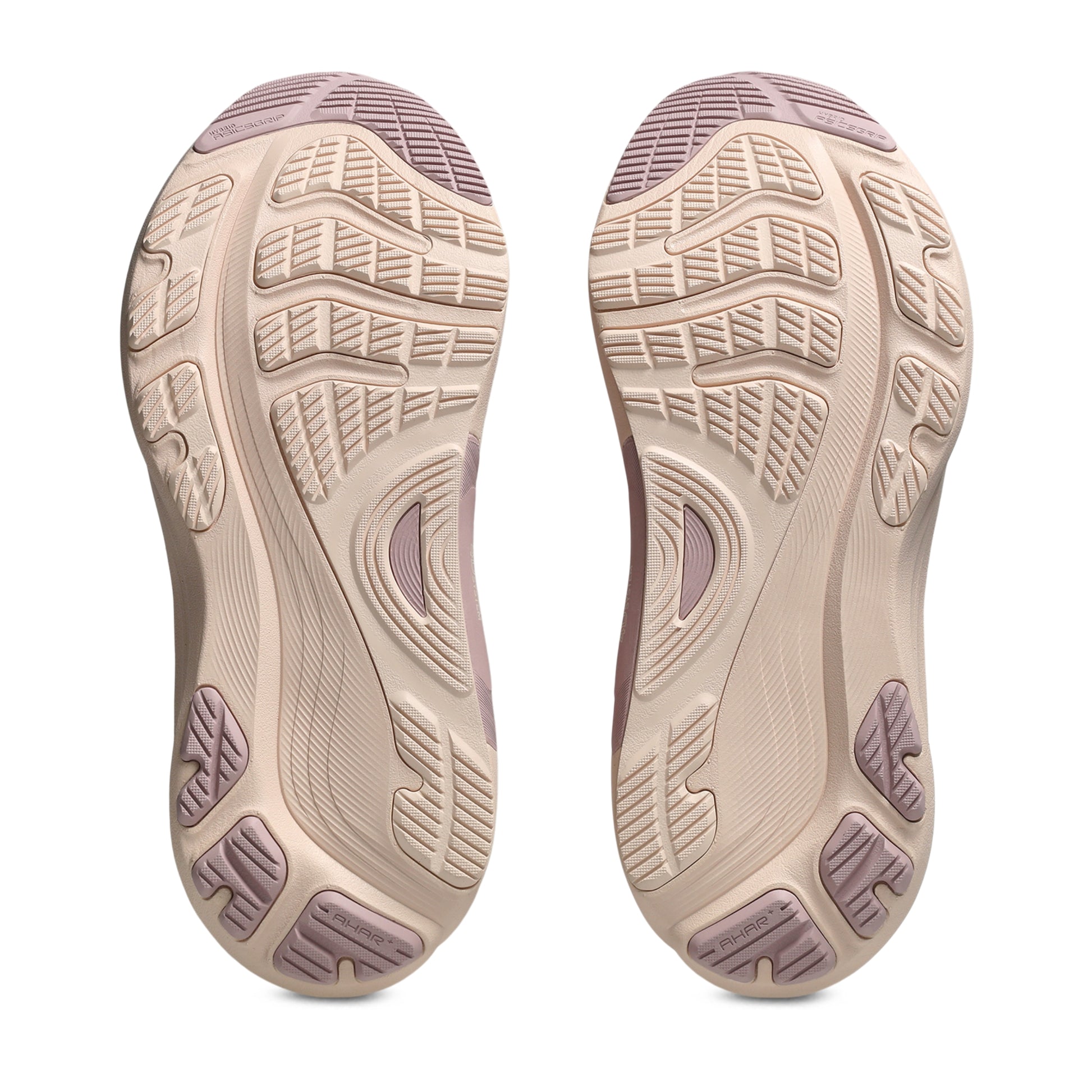 Close-up of a pair of shoes with a focus on the sole design on a white background