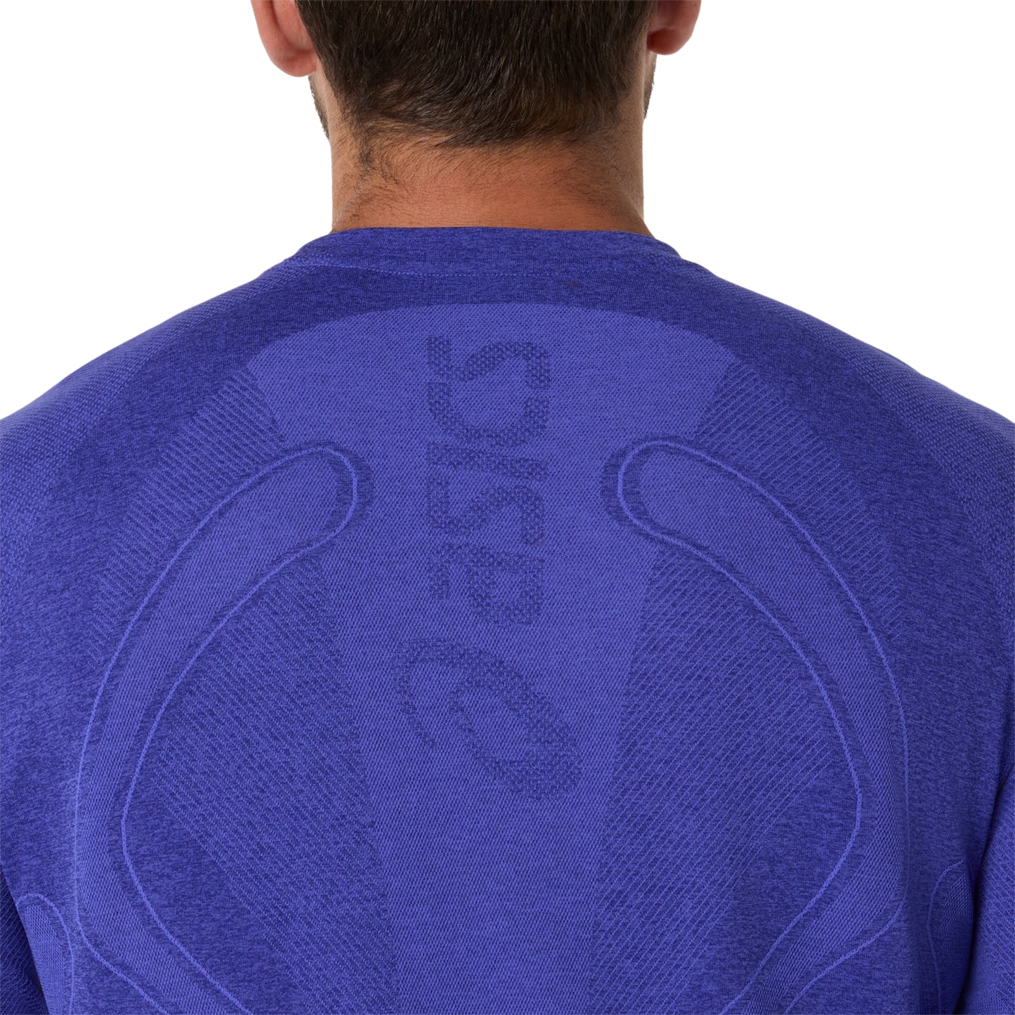 Blue athletic shirt with a brand logo on the back, worn by a person.