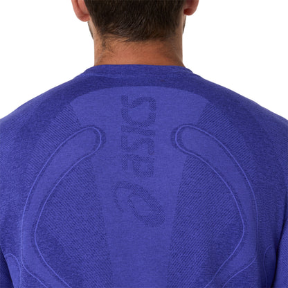 Blue athletic shirt with a brand logo on the back, worn by a person.