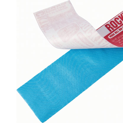 Roll of blue tape with a white corner and red label on a white background