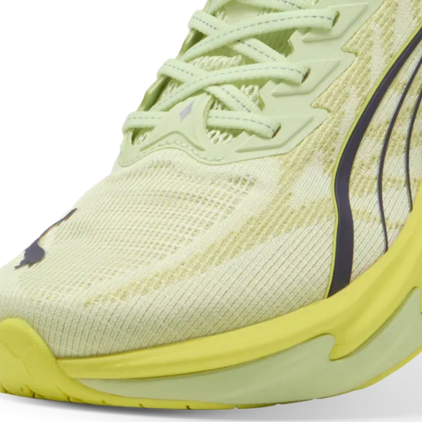 Close-up of a yellow Puma shoe with a yellow sole on a white background
