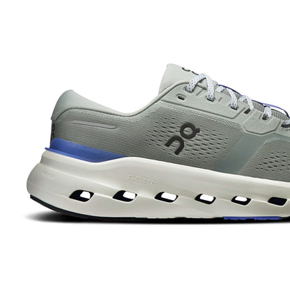A side profile view of an On running shoe in light gray and white with a blue accent stripe and logo, set against a plain white background.