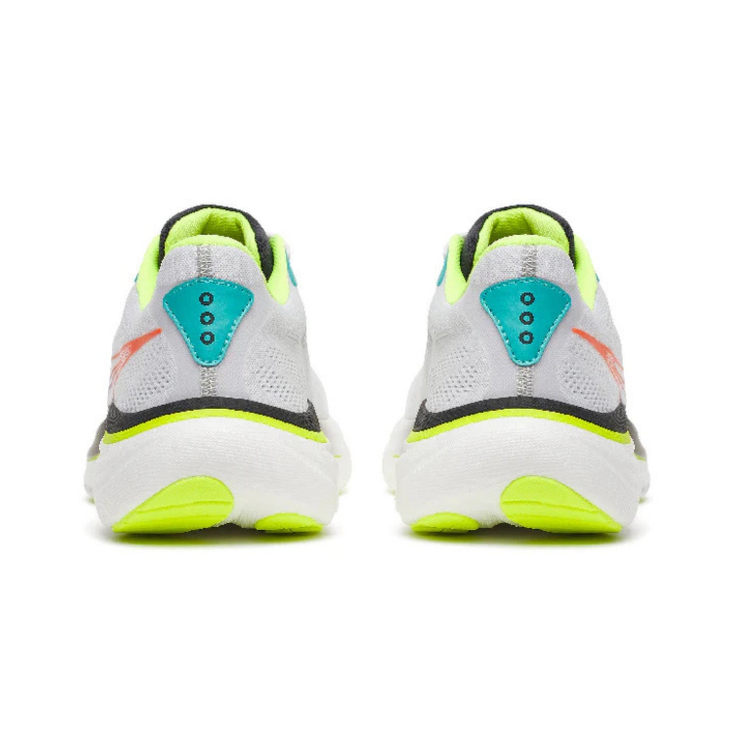 White and black running shoes with yellow accents on a white background