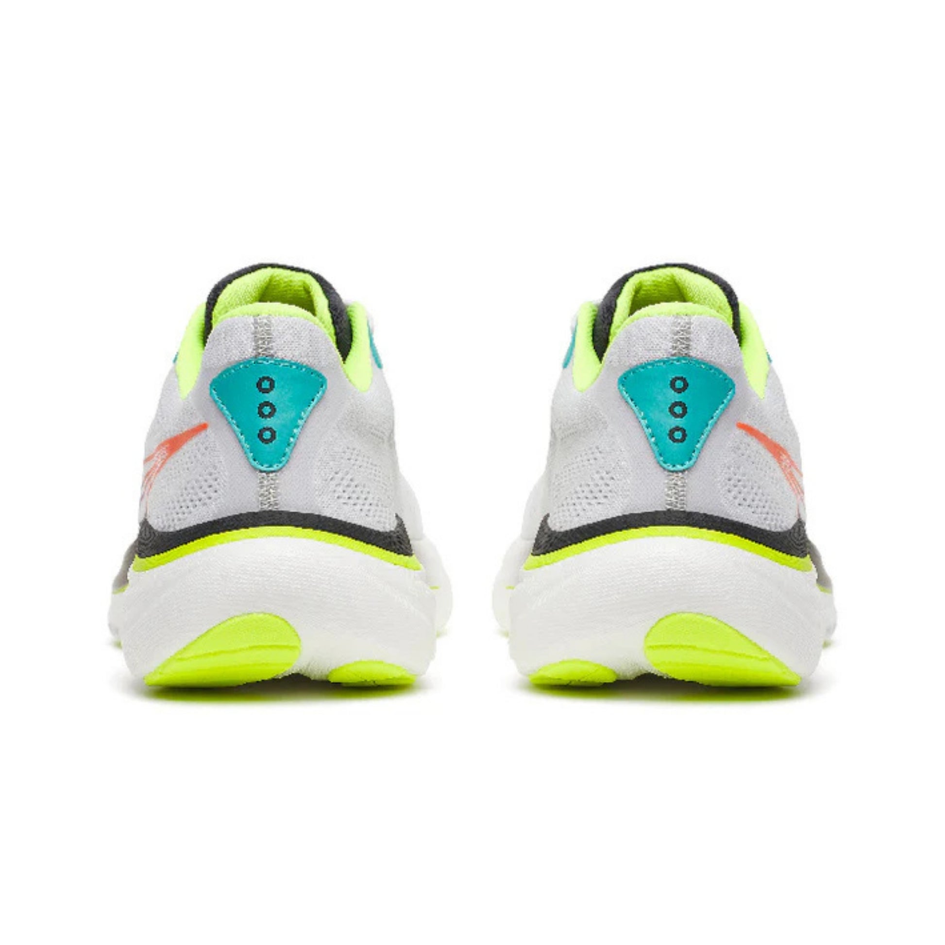 White and black running shoes with yellow accents on a white background