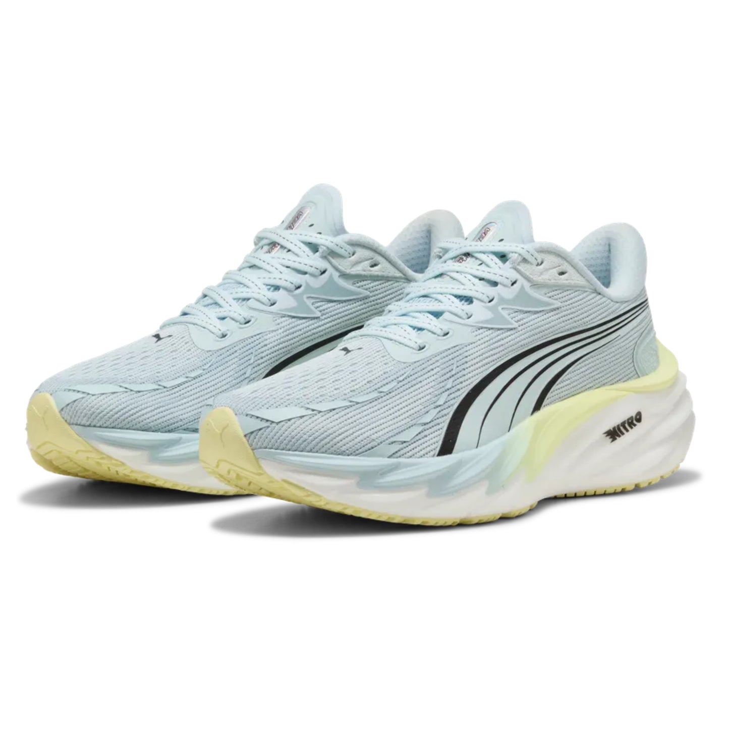 Light blue running shoes with yellow soles on a white background
