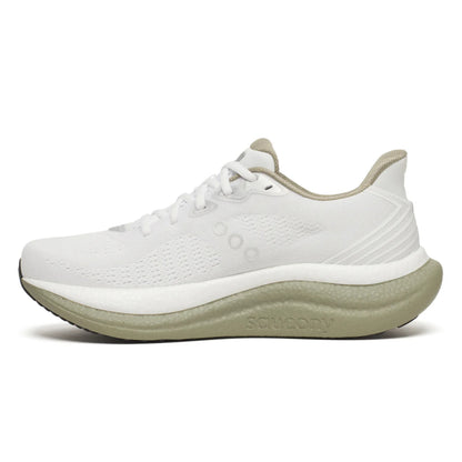 White Saucony running shoe with green sole on a white background