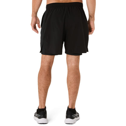 Person wearing black running shorts on a white background