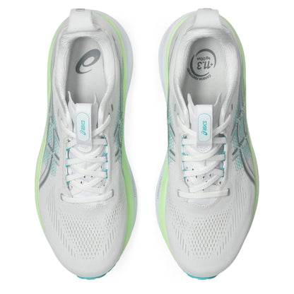 White Asics running shoes with green accents on a white background
