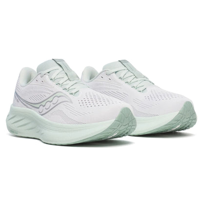 White and light green Saucony running shoe with a light green sole 