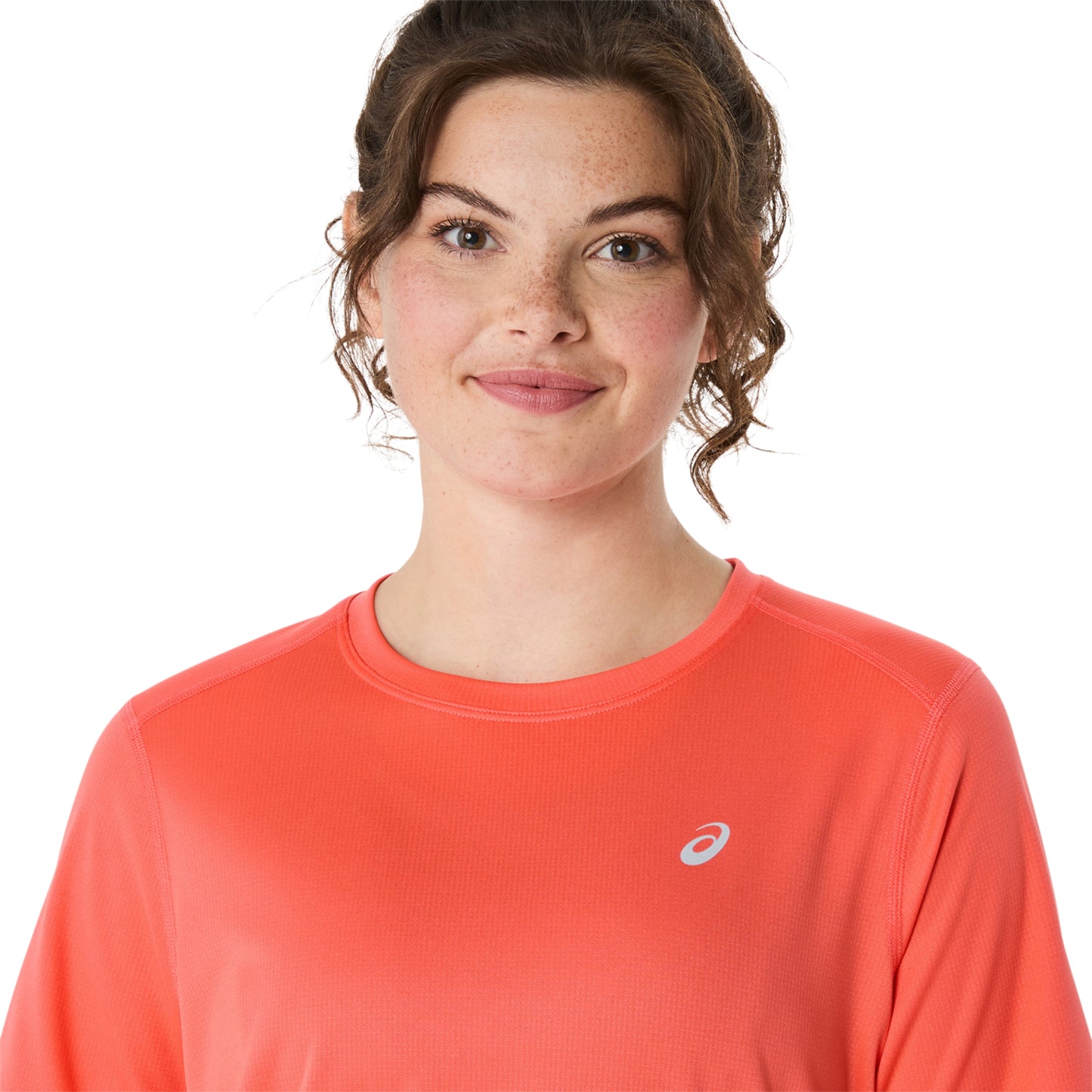 Close-up of a person wearing coral shirt on a white background