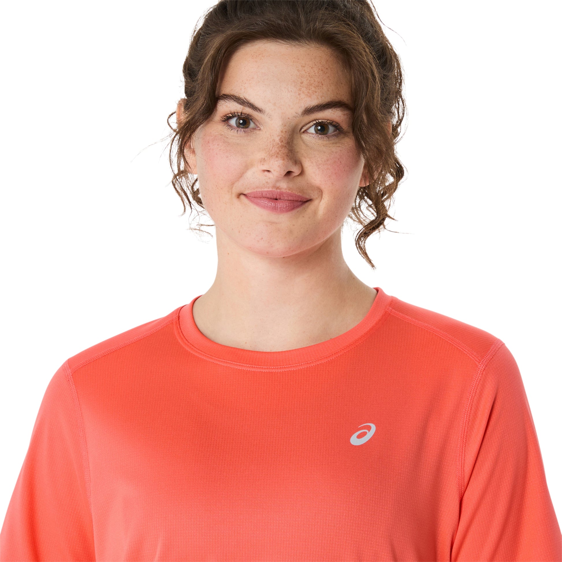 Close-up of a person wearing coral shirt on a white background