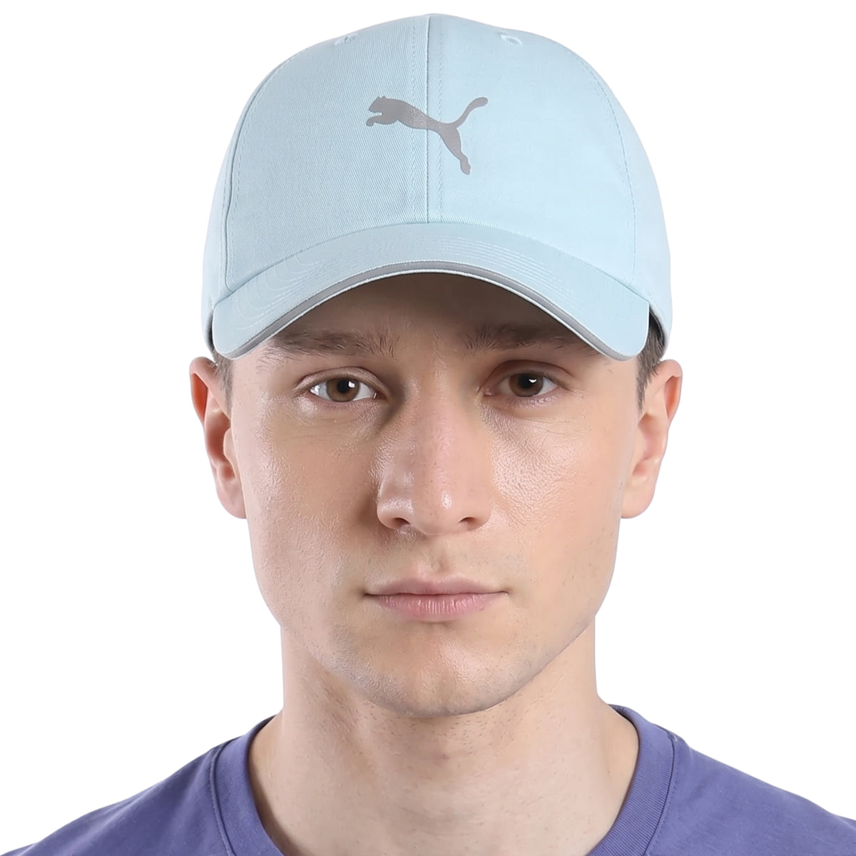 Person wearing a light blue Puma cap with a silver logo on a white background