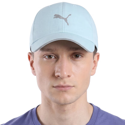 Person wearing a light blue Puma cap with a silver logo on a white background