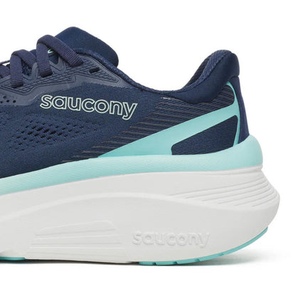 Navy and light blue running shoe with 'Saucony' branding on a white background