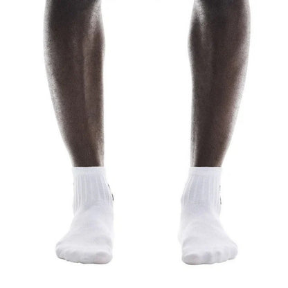 White ankle socks worn on a person's legs, shown against a plain white background.