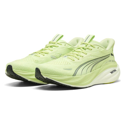 Pair of light green Puma running shoes on a white background