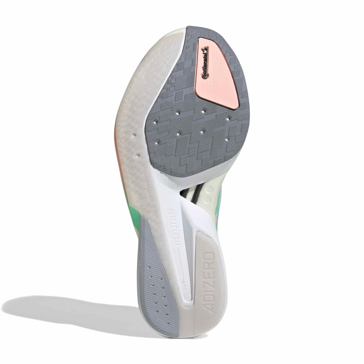 The outsole of a Adidas running shoe, showing the textured gray and white tread with a pink accent panel and green accents, on a white background.