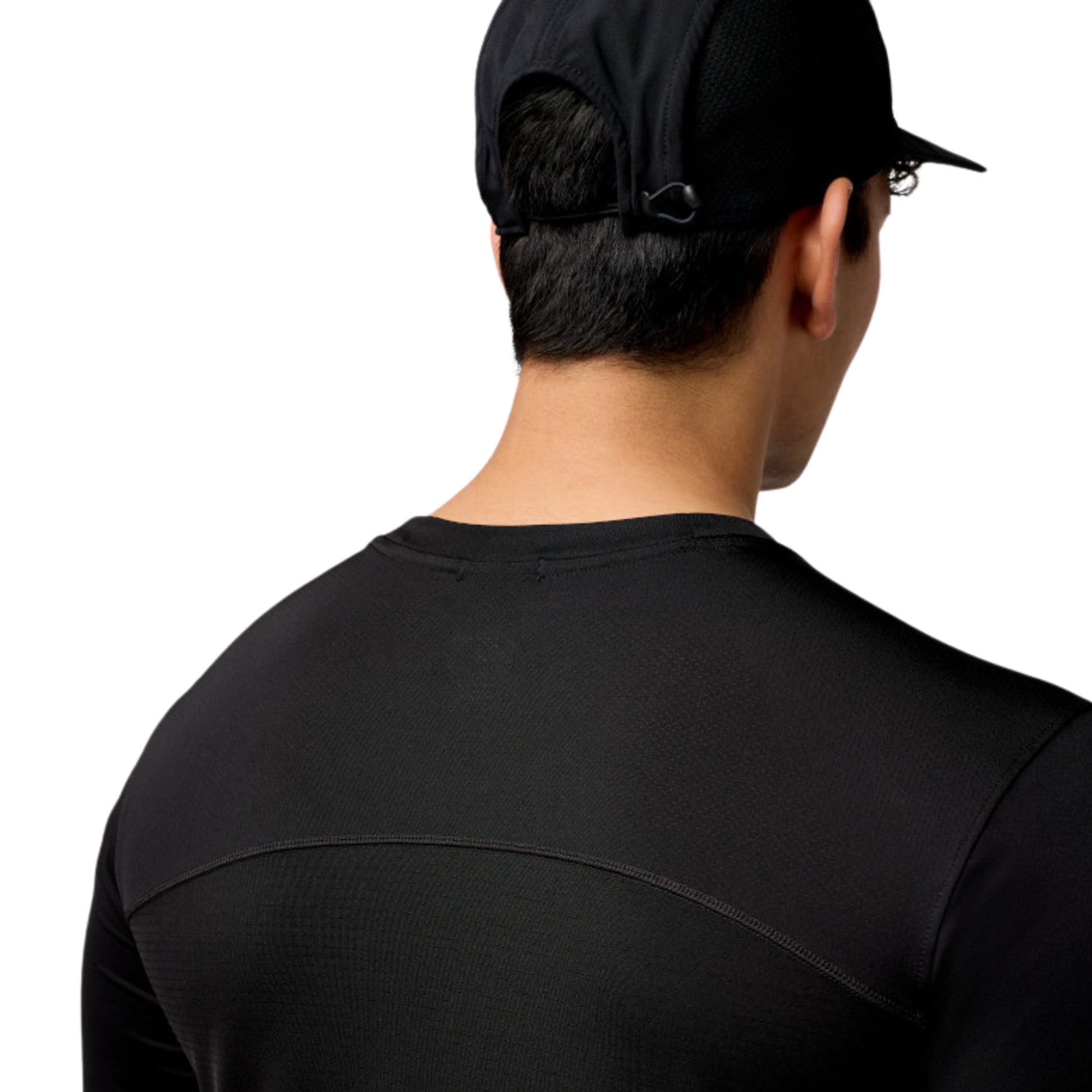 Rear view of a man wearing a black long-sleeve athletic shirt and a black baseball cap against a white background.