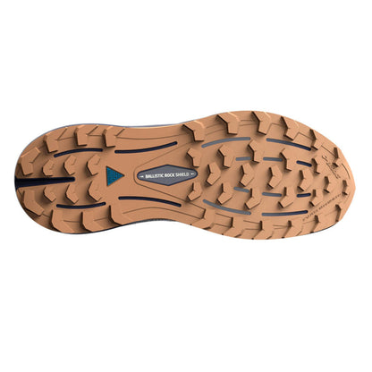 Close-up of a brown running shoe sole with tread pattern on a white background