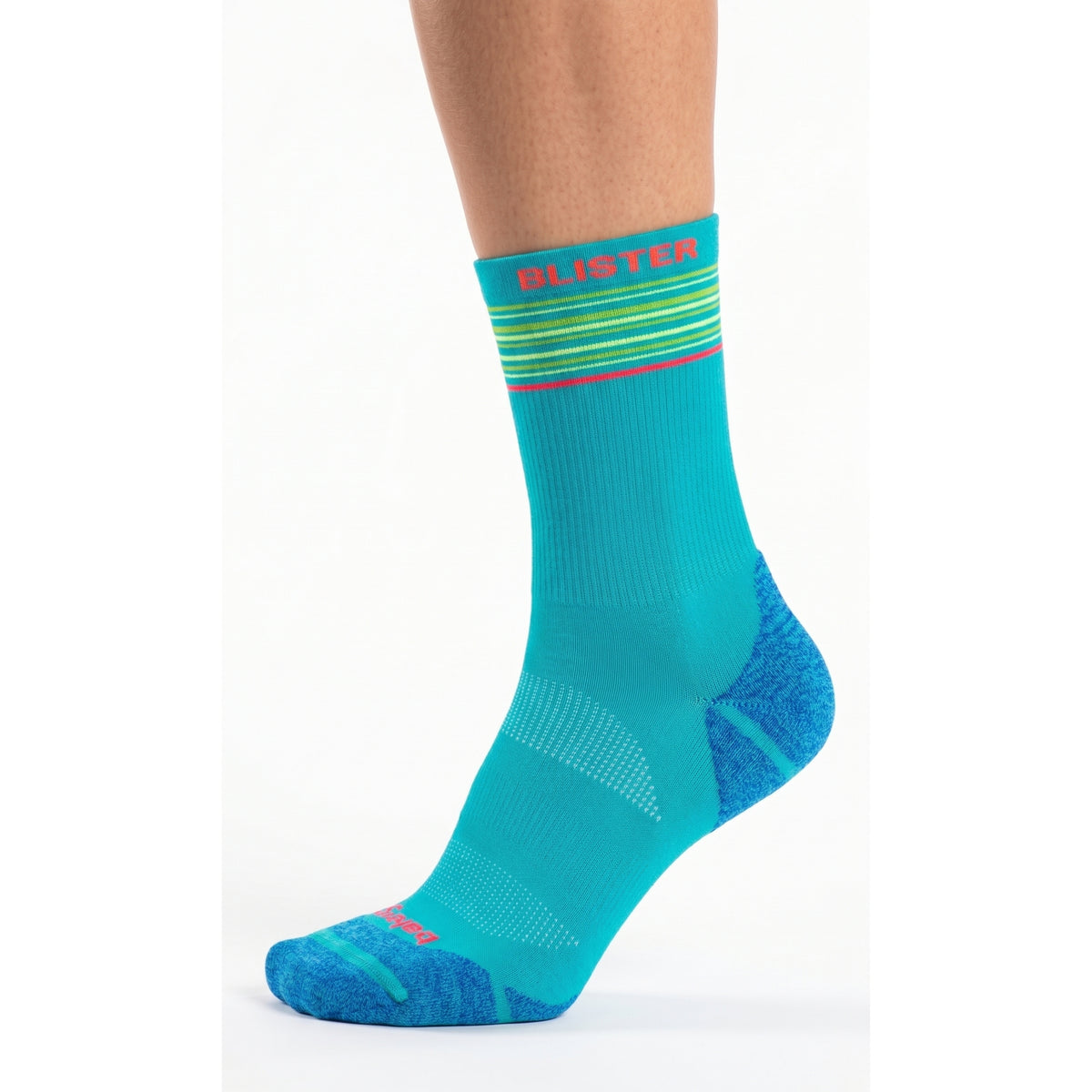 A single crew sock shown on a cropped human foot and lower leg against a clean white studio background. The sock is predominantly bright turquoise/teal with darker blue heel and toe areas, thin multicolor horizontal stripes near the cuff, and pink text reading 'BLUSTER' on the cuff.