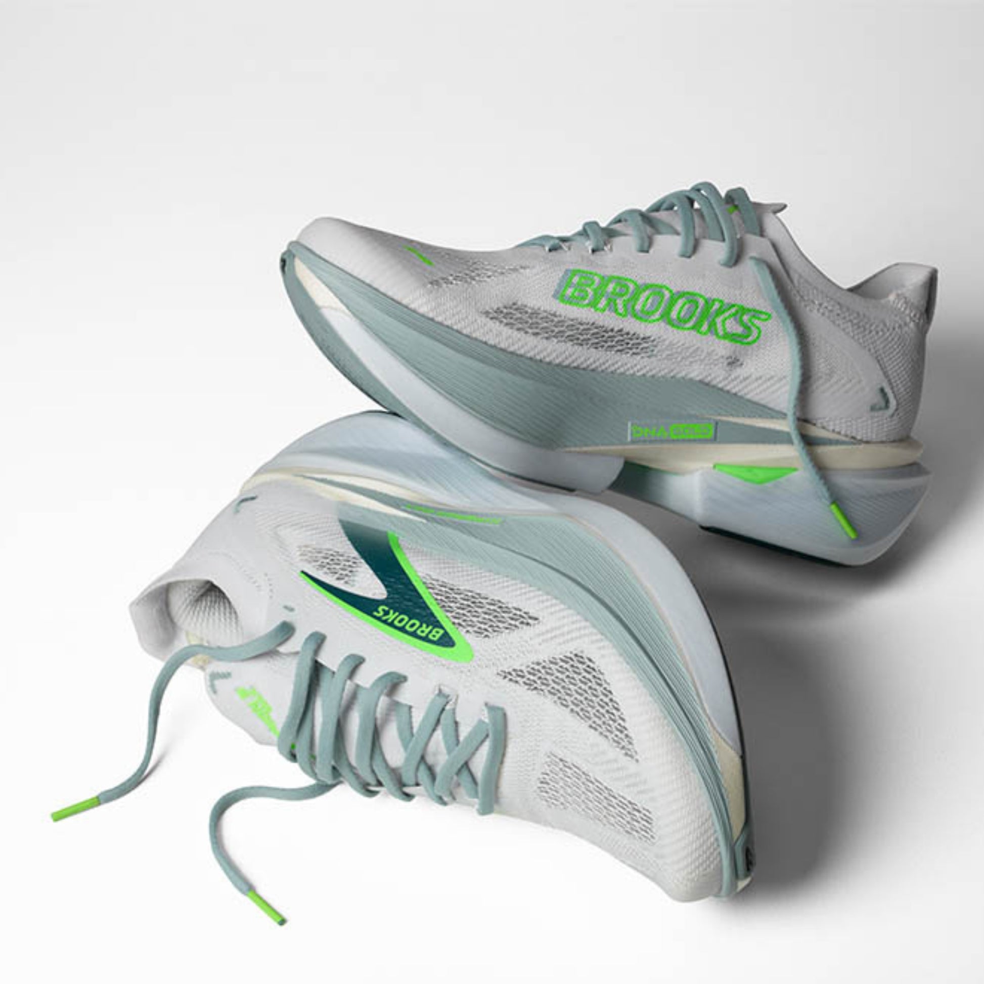 Gray and green Brooks running shoes with 'Brooks' branding on a white background