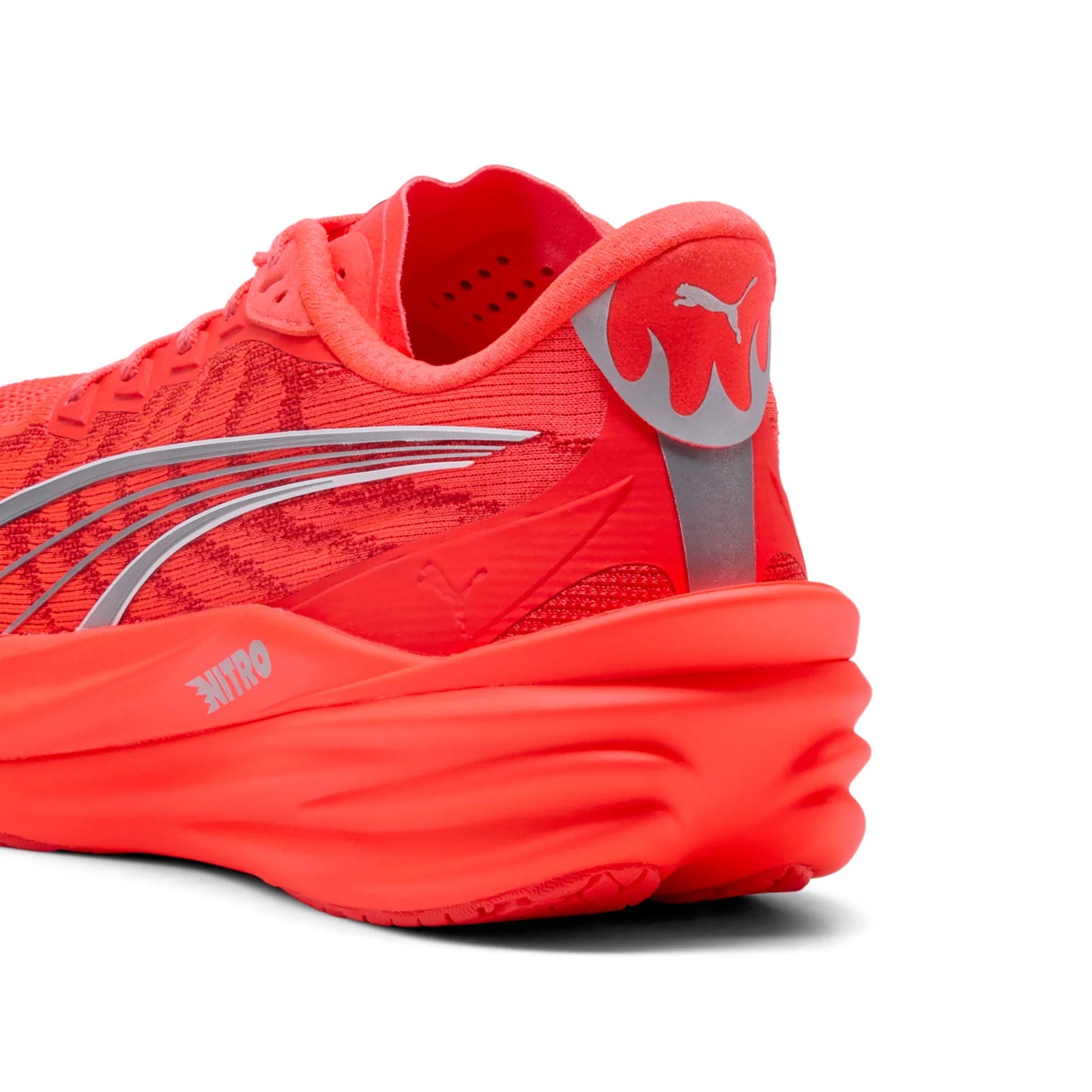Red running shoe with a white background