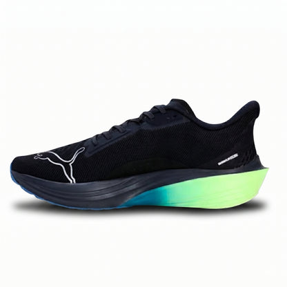 Navy Puma running shoe with green sole on a white background
