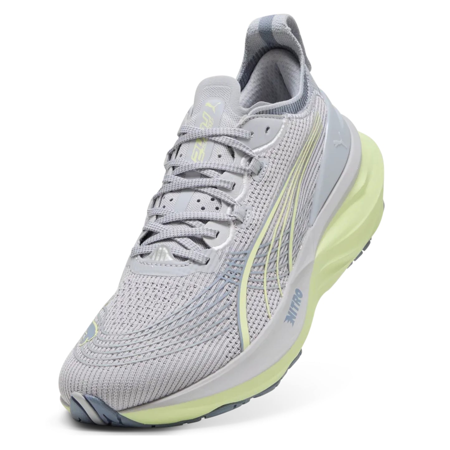 Gray Puma running shoe with green sole on a white background