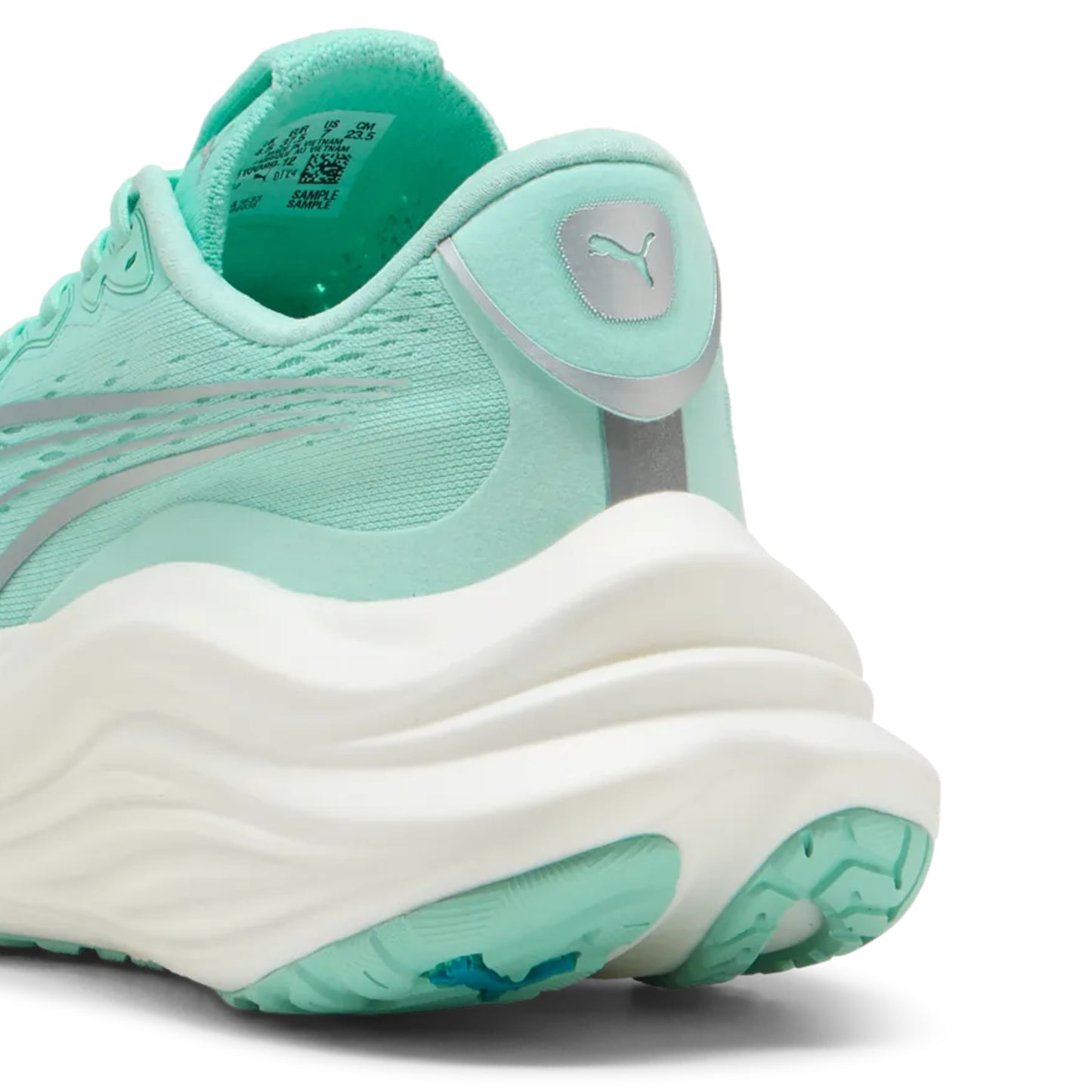 Mint green running shoe with white sole on a white background