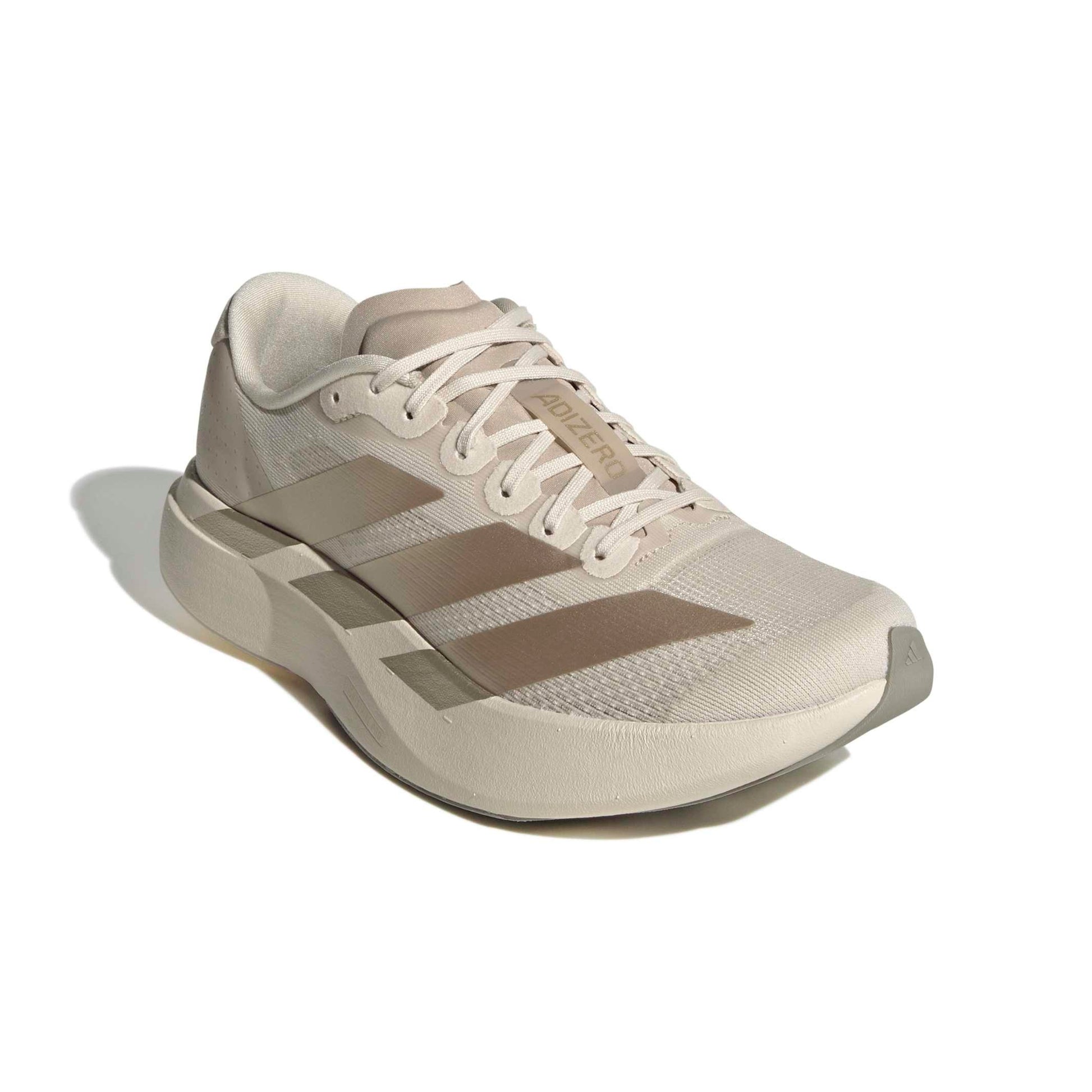 Beige Adidas running shoe on a white background