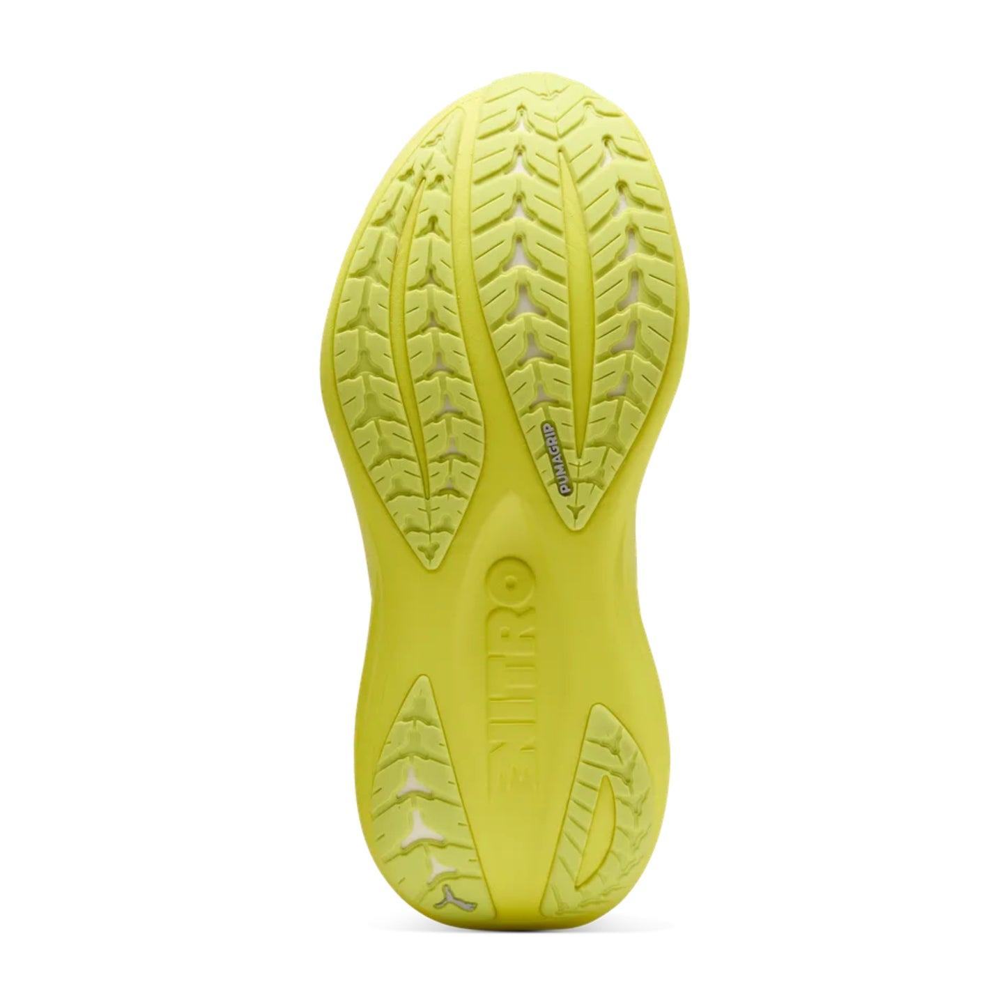 Close-up of a yellow Puma running shoe sole with tread pattern on a white background