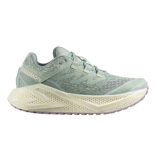 Light green Salomon running shoe with a white sole on a white background