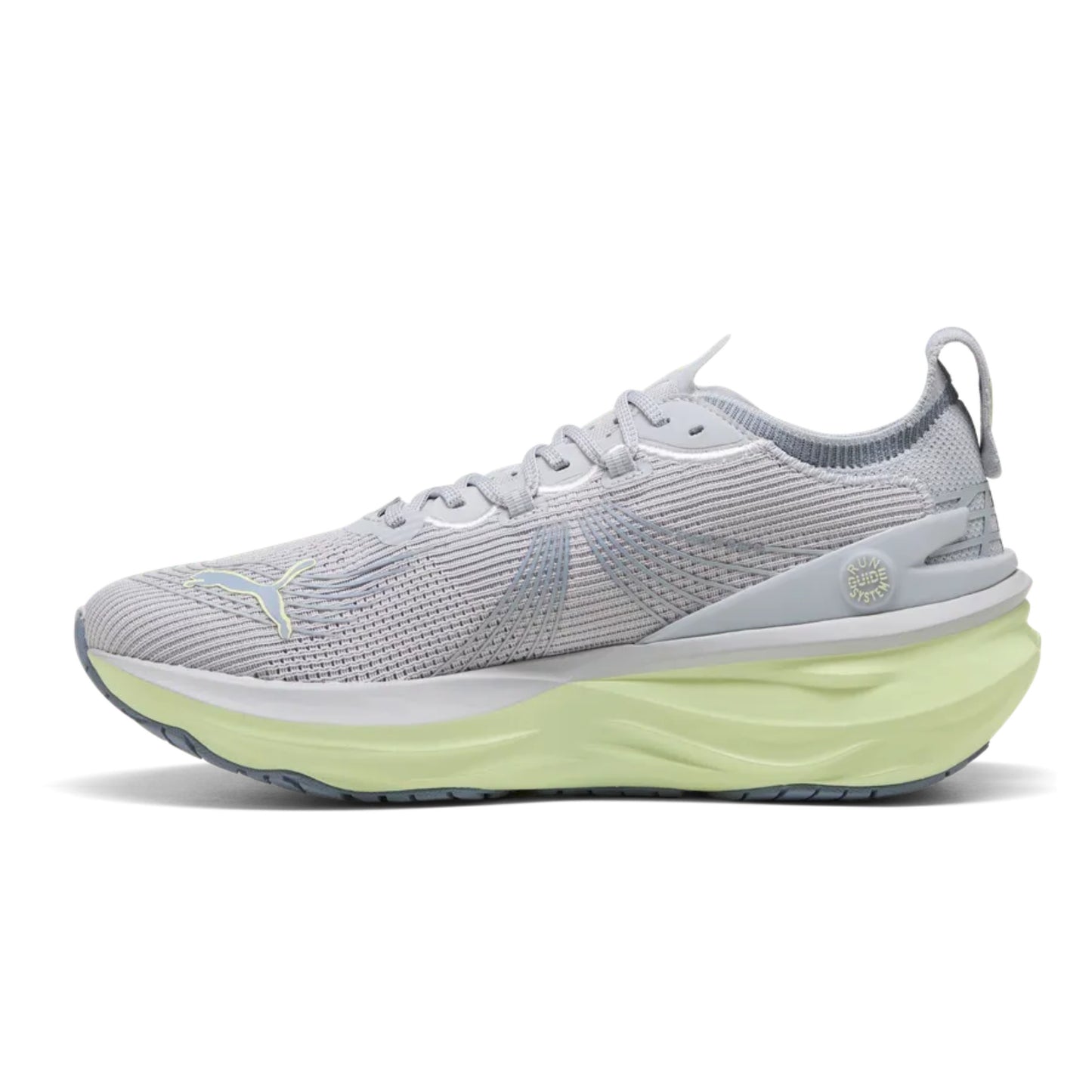 Gray Puma running shoe with a green sole on a white background