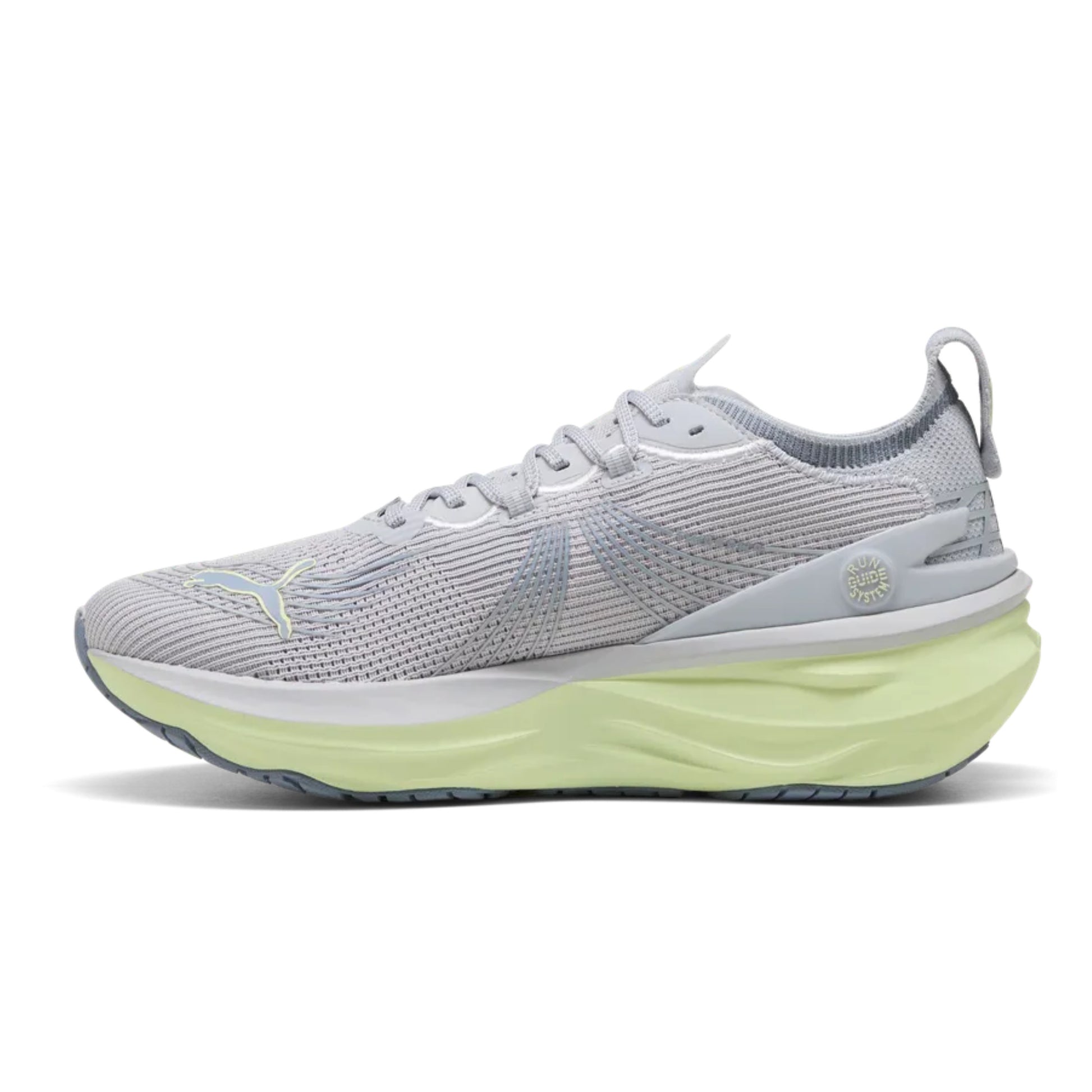 Gray Puma running shoe with a green sole on a white background