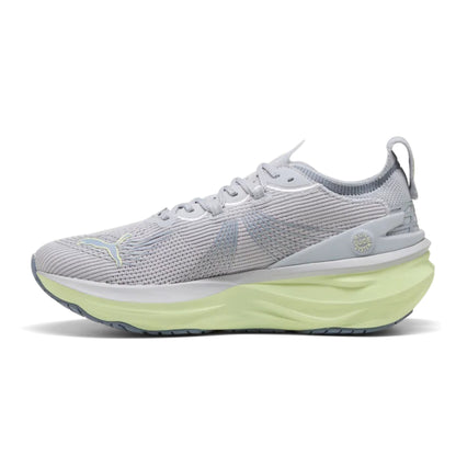Gray Puma running shoe with a green sole on a white background