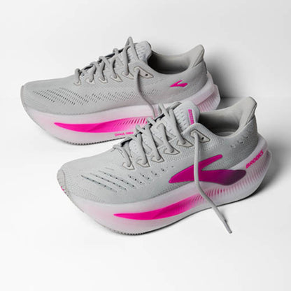 Gray Brooks running shoes with pink accents on a white background