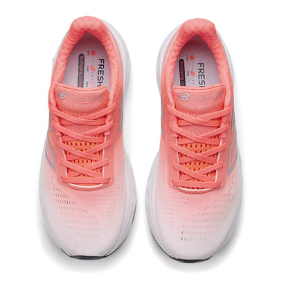 Pair of red and white running shoes with white soles on a white background