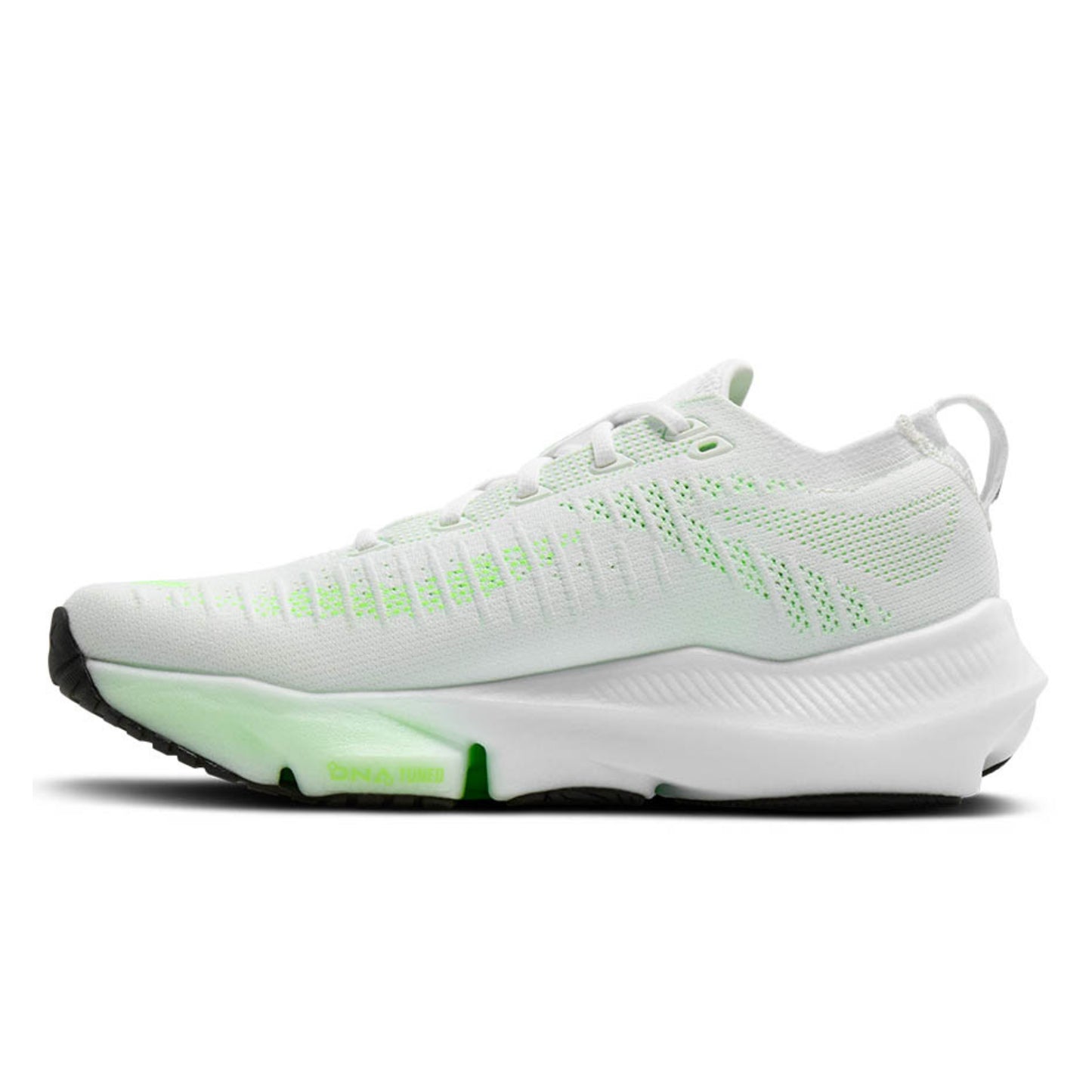 White and green Brooks running shoe on a white background
