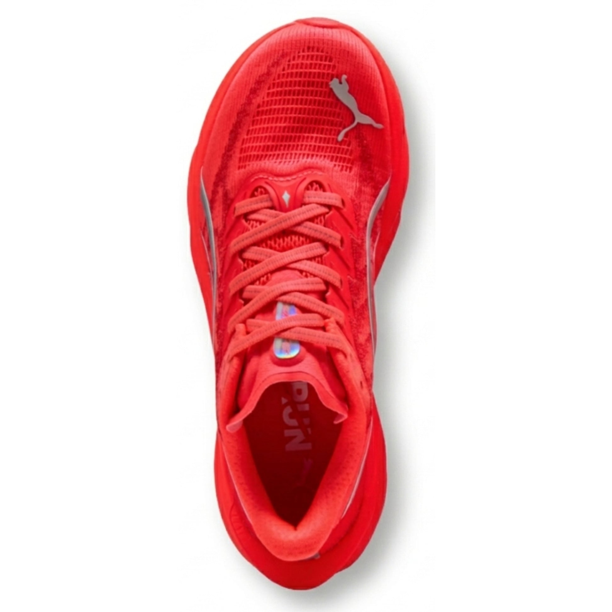 Red Puma running shoe with a white background