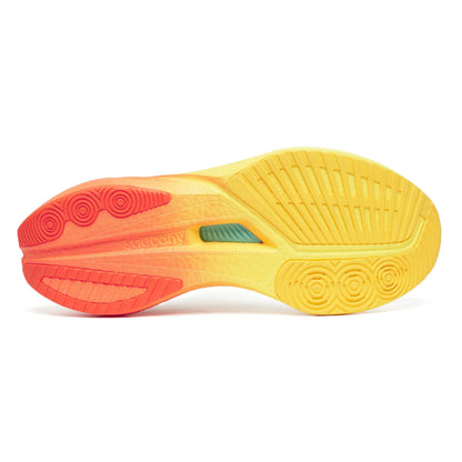 Close-up of a yellow and red Saucony running shoe sole on a white background